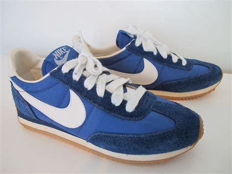 blue and white nike shoes|nike white with blue swoosh.